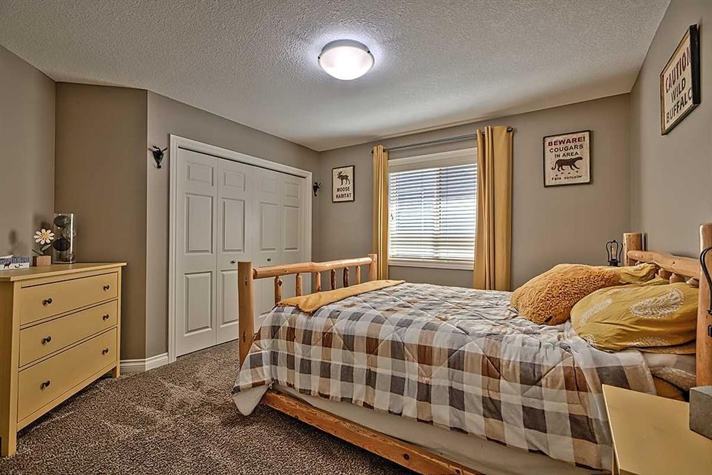 732 Hampton Hills Drive Ne, High River, AB - Indoor Photo Showing Bedroom