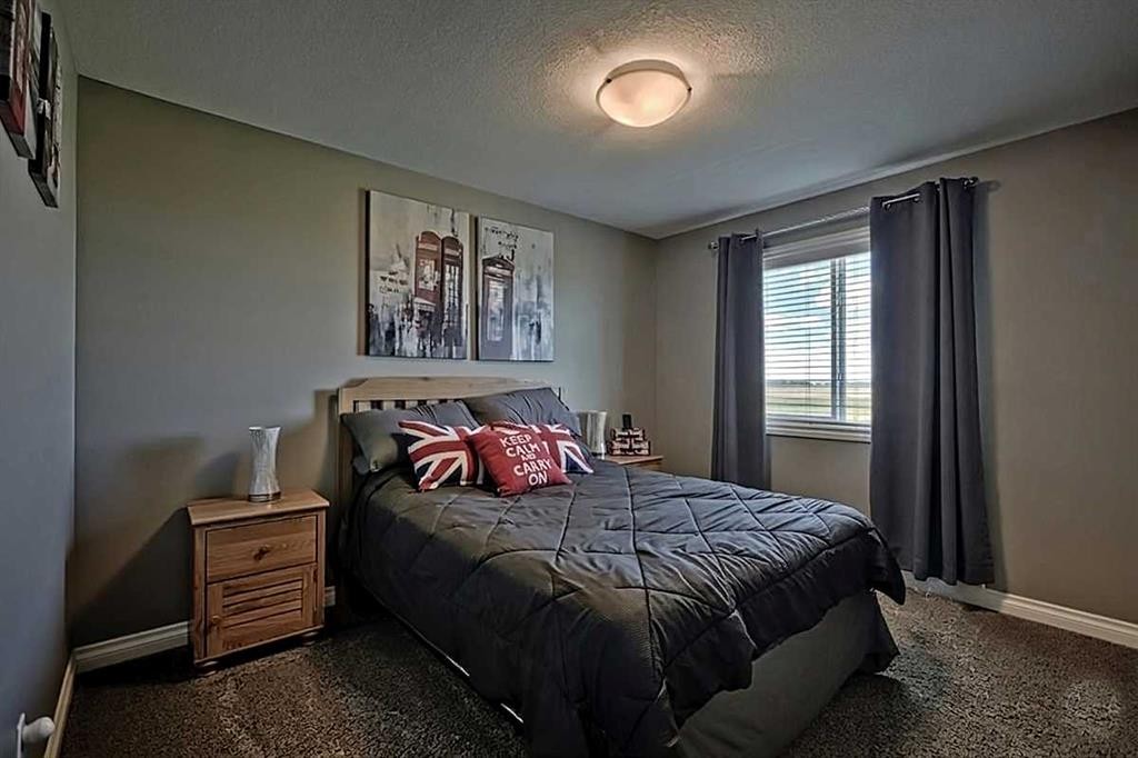732 Hampton Hills Drive Ne, High River, AB - Indoor Photo Showing Bedroom