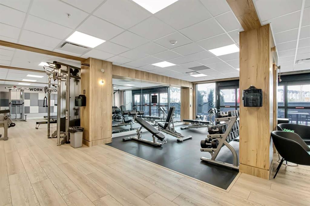 208-255 Les Jardins Park Se, Calgary, AB - Indoor Photo Showing Gym Room