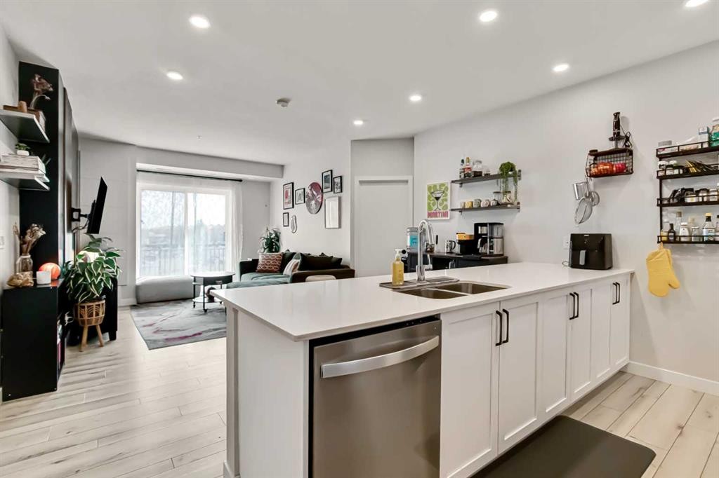 208-255 Les Jardins Park Se, Calgary, AB - Indoor Photo Showing Kitchen With Double Sink