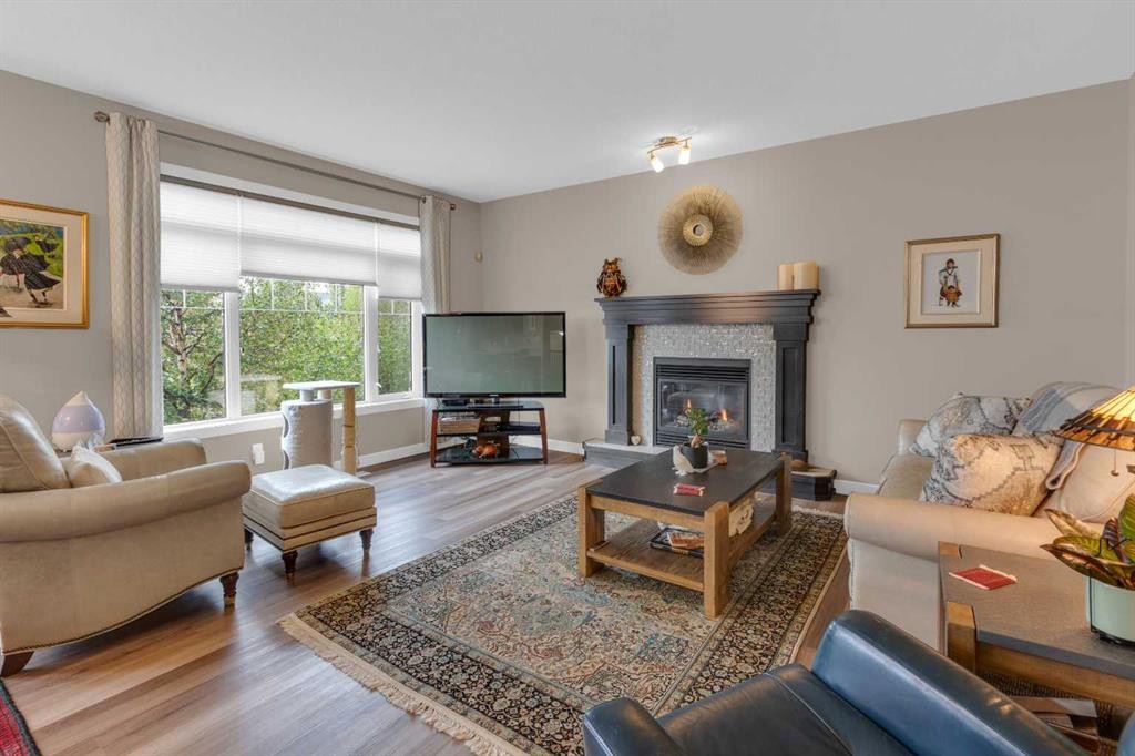 172 Ridge View Close, Cochrane, AB - Indoor Photo Showing Living Room With Fireplace