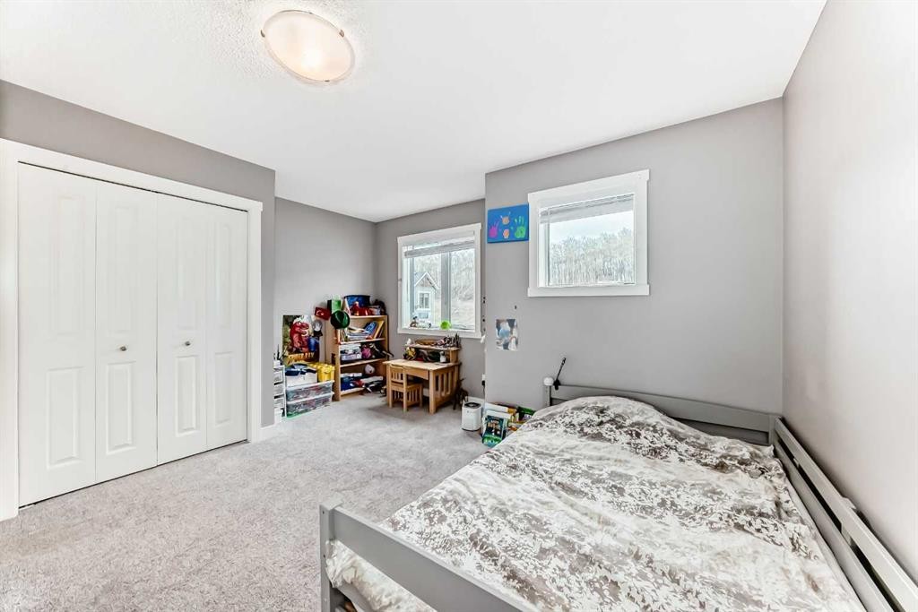 49 Aspen Hills Drive Sw, Calgary, AB - Indoor Photo Showing Bedroom