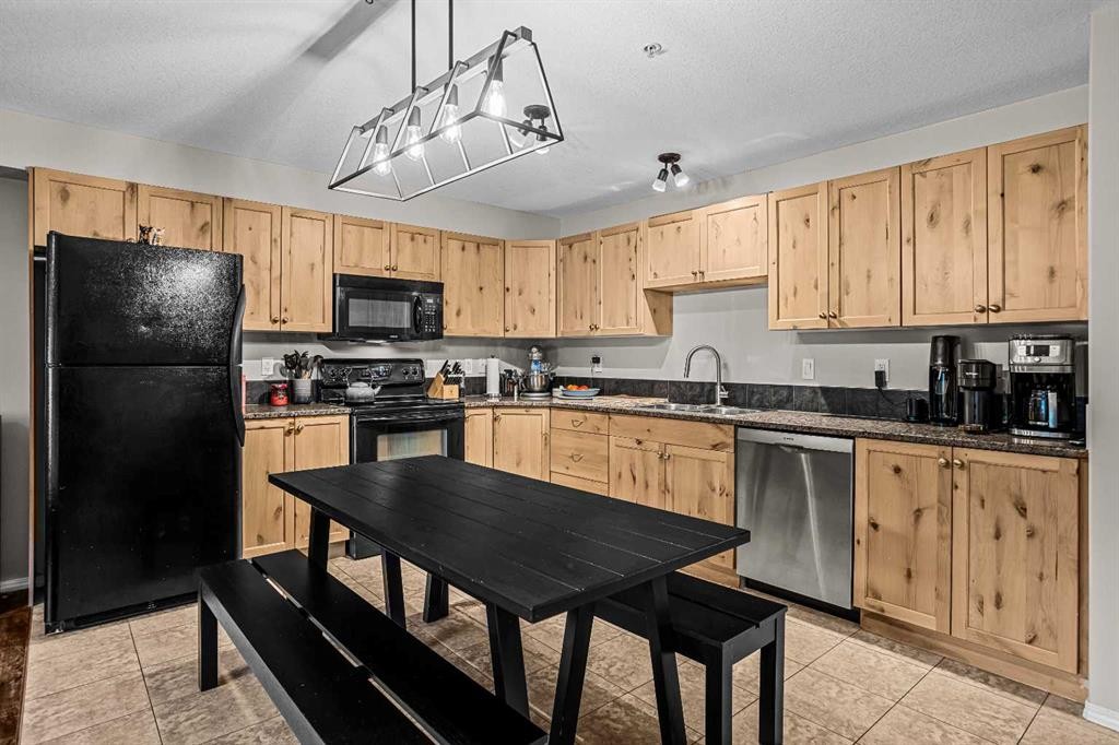 111-300 Palliser, Canmore, AB - Indoor Photo Showing Kitchen