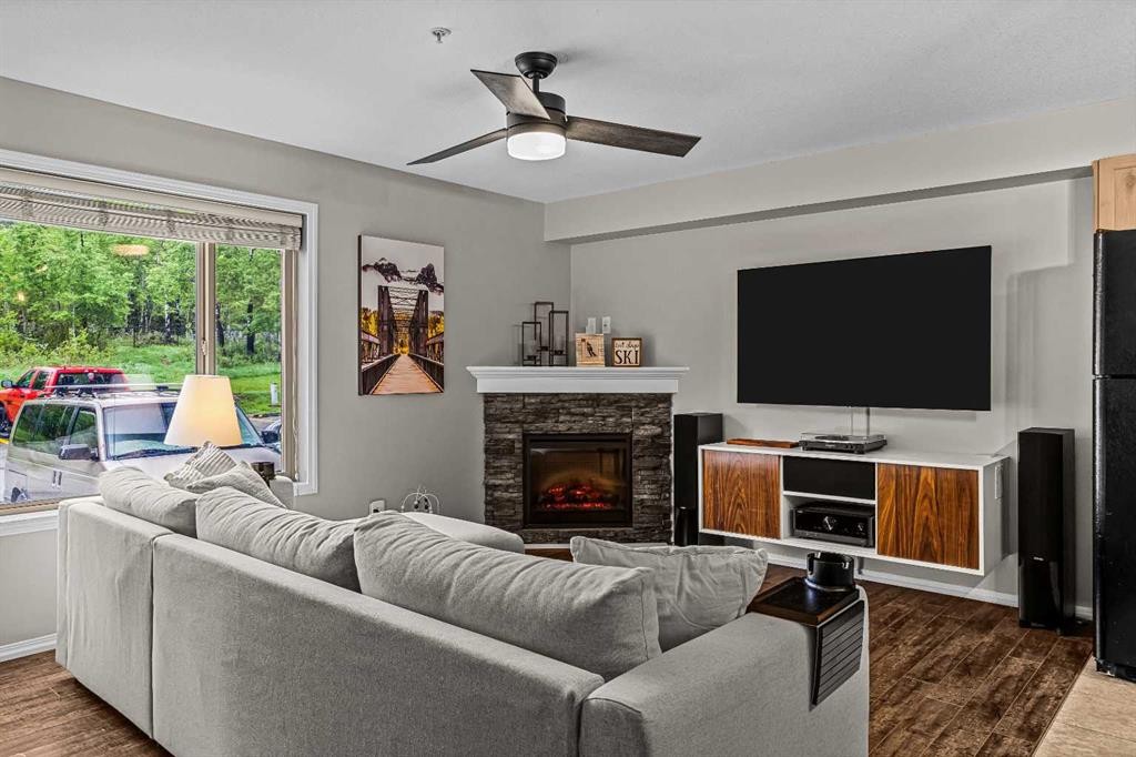 111-300 Palliser, Canmore, AB - Indoor Photo Showing Living Room With Fireplace