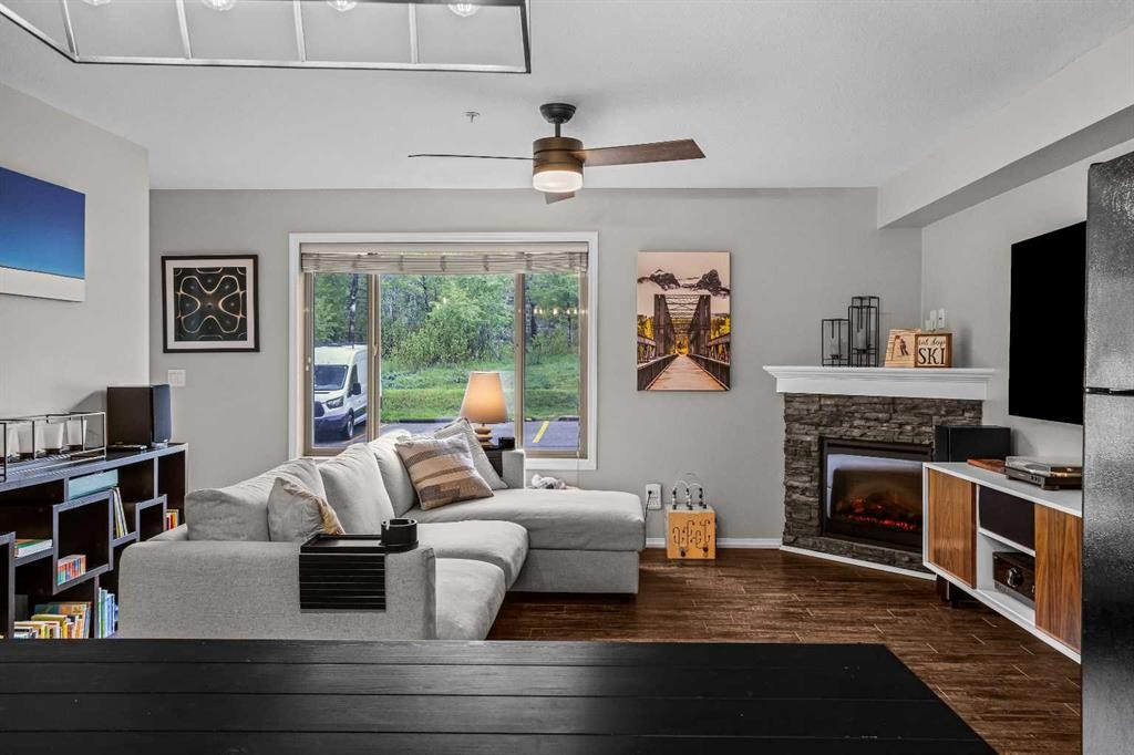 111-300 Palliser, Canmore, AB - Indoor Photo Showing Living Room With Fireplace
