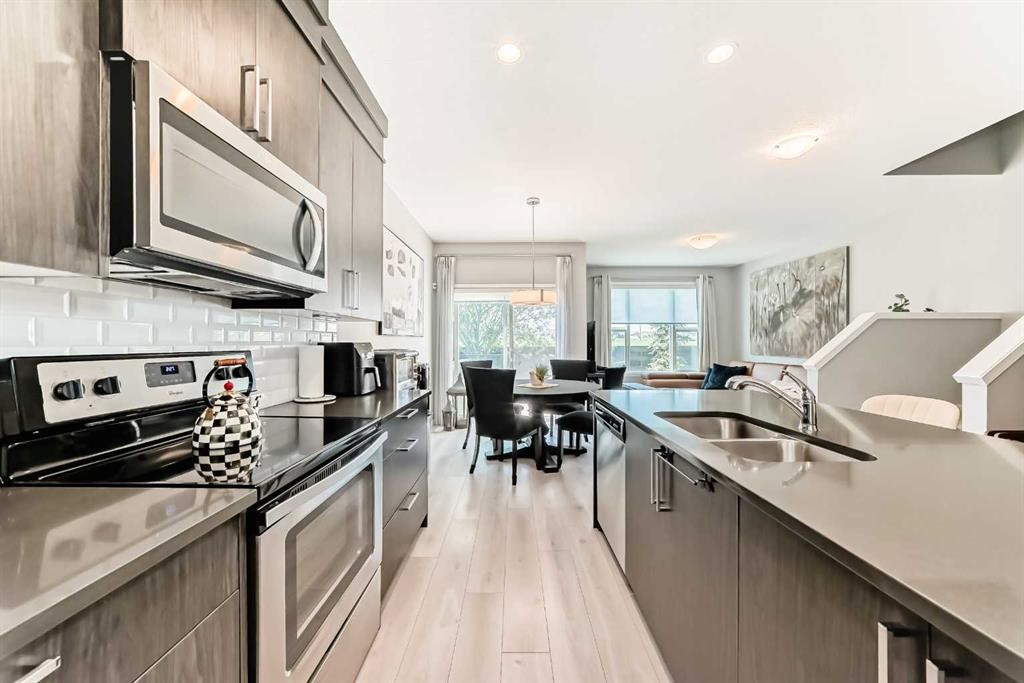 984 Seton Circle Se, Calgary, AB - Indoor Photo Showing Kitchen With Double Sink With Upgraded Kitchen