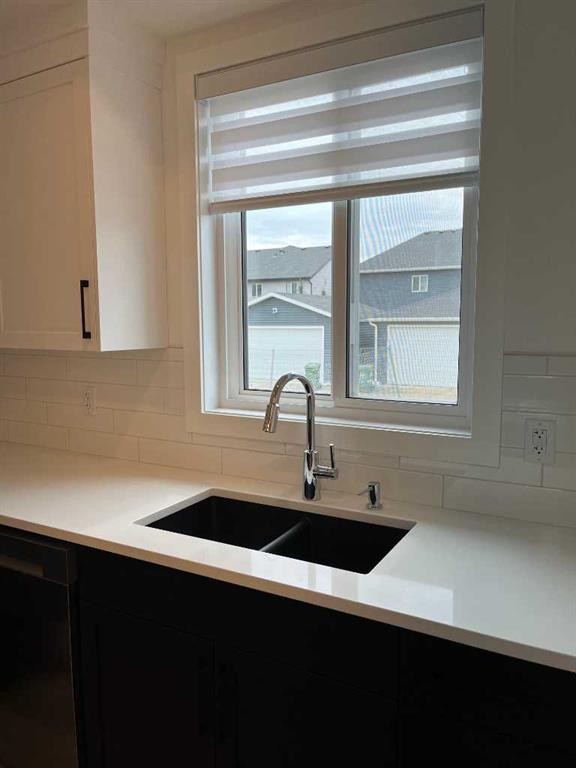 49 Legacy Point Terrace Se, Calgary, AB - Indoor Photo Showing Kitchen With Double Sink