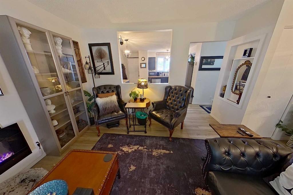 3232 Doverville Crescent Se, Calgary, AB - Indoor Photo Showing Living Room With Fireplace