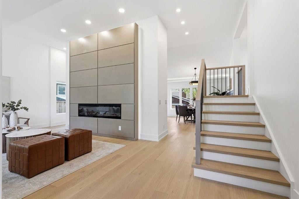 60 Lake Lucerne Close Se, Calgary, AB - Indoor Photo Showing Other Room With Fireplace