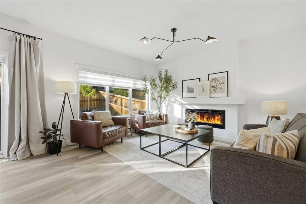 92 Heritage Hill, Cochrane, AB - Indoor Photo Showing Living Room With Fireplace