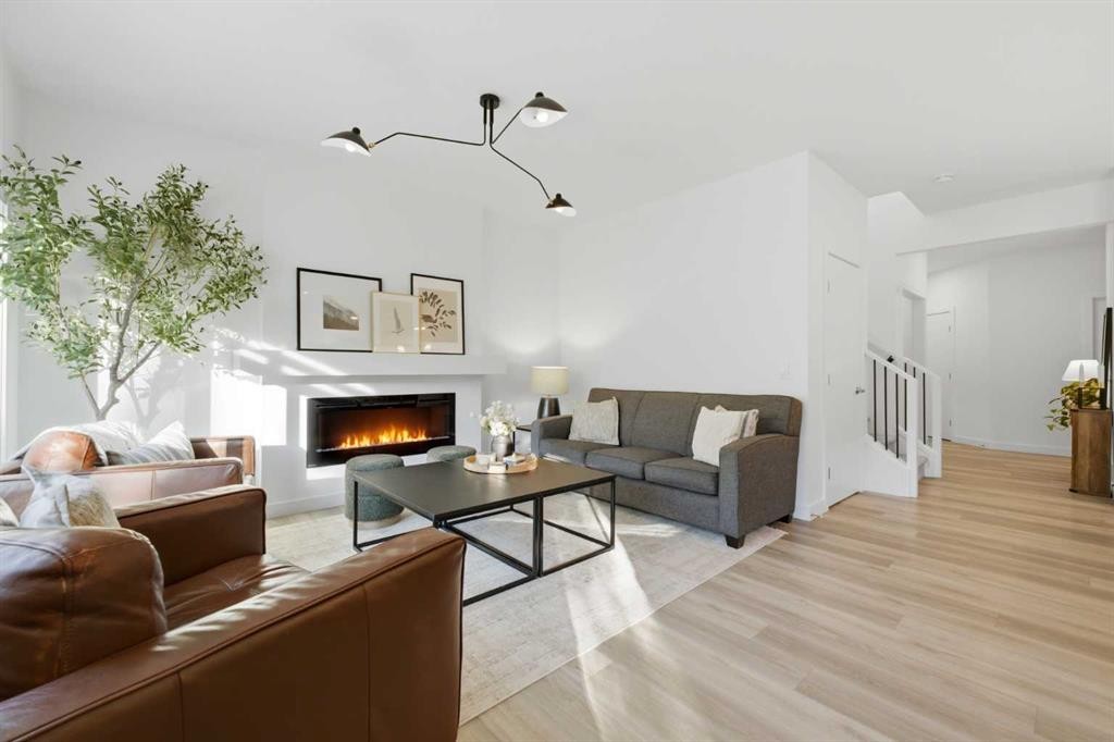 92 Heritage Hill, Cochrane, AB - Indoor Photo Showing Living Room With Fireplace