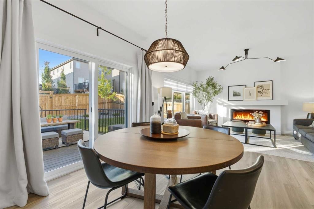 92 Heritage Hill, Cochrane, AB - Indoor Photo Showing Dining Room With Fireplace