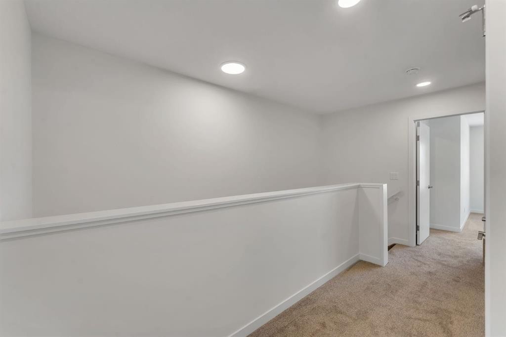 7 Heritage Heath, Cochrane, AB - Indoor Photo Showing Other Room