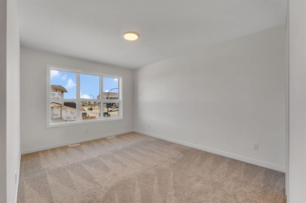 7 Heritage Heath, Cochrane, AB - Indoor Photo Showing Other Room