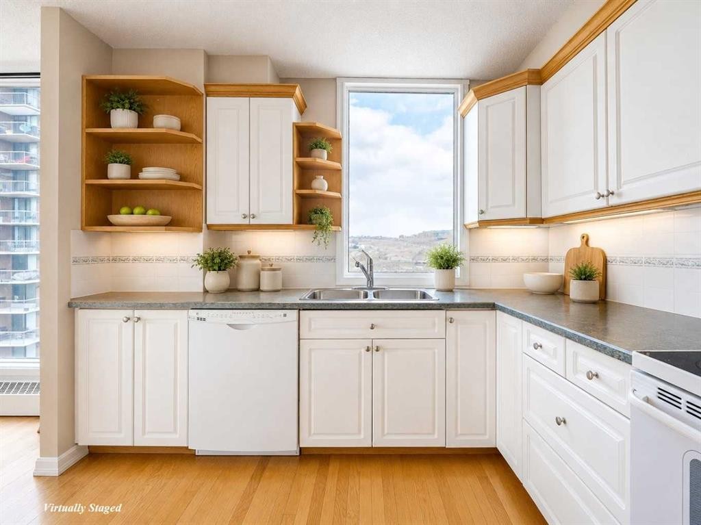 1002-145 Point Drive Nw, Calgary, AB - Indoor Photo Showing Kitchen With Double Sink