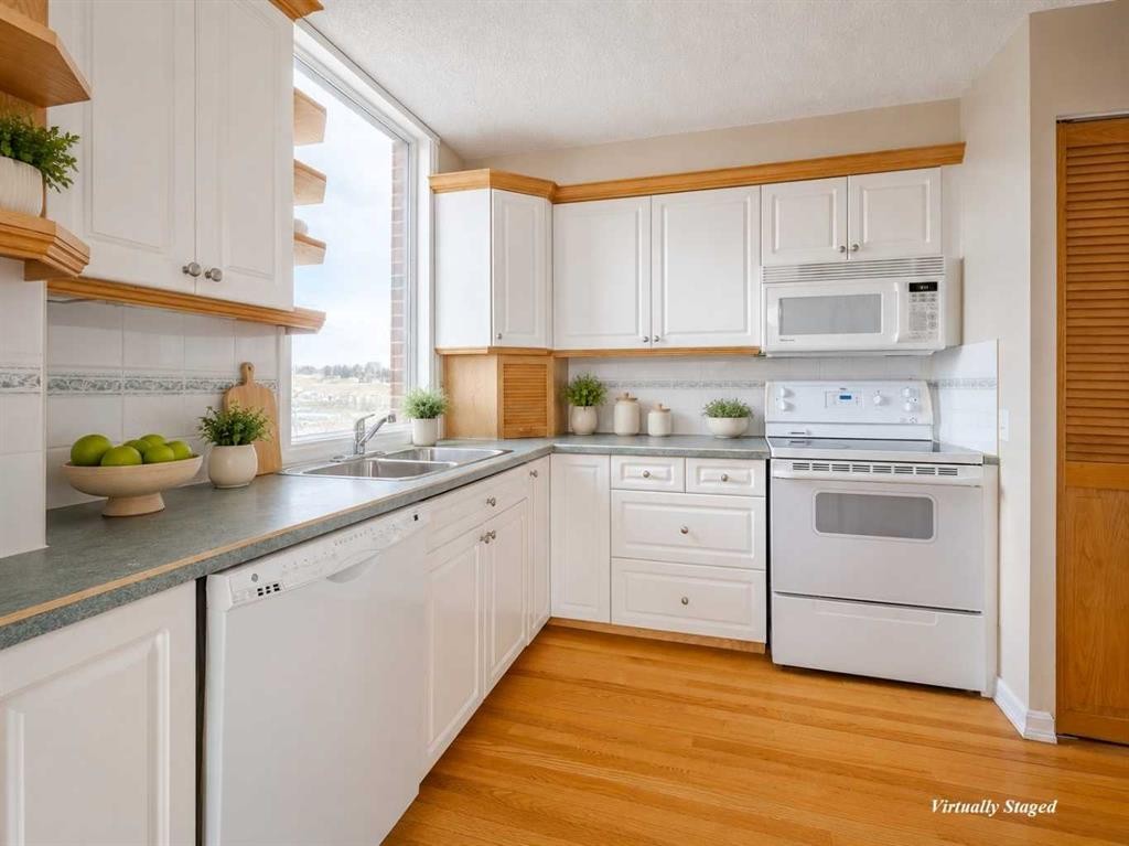 1002-145 Point Drive Nw, Calgary, AB - Indoor Photo Showing Kitchen With Double Sink