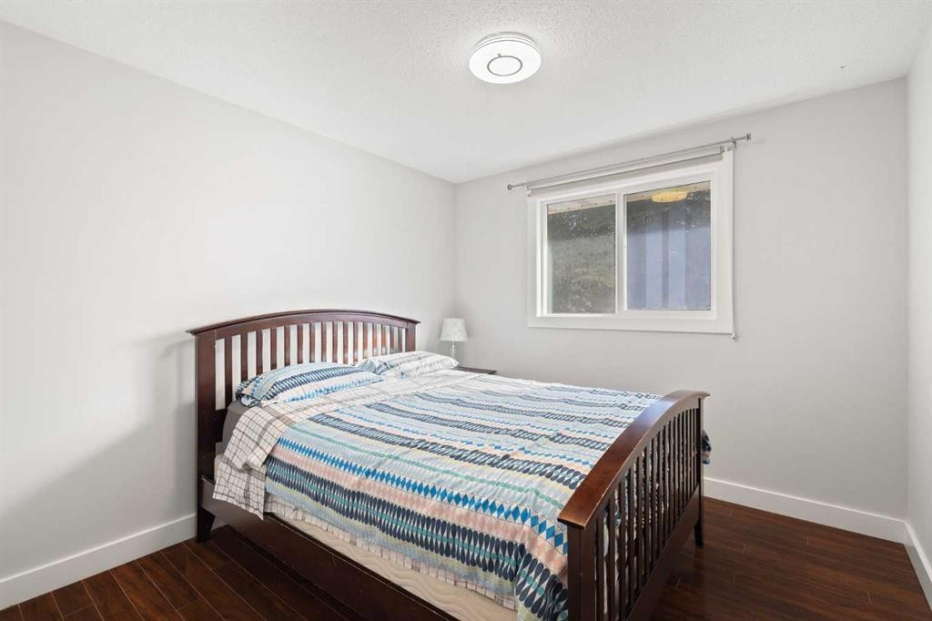 208 Woodpark Place Sw, Calgary, AB - Indoor Photo Showing Bedroom