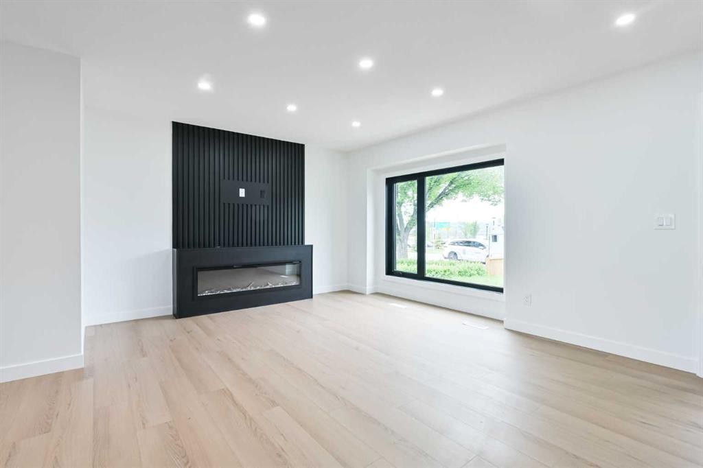 4940 45 Street Sw, Calgary, AB - Indoor Photo Showing Living Room With Fireplace