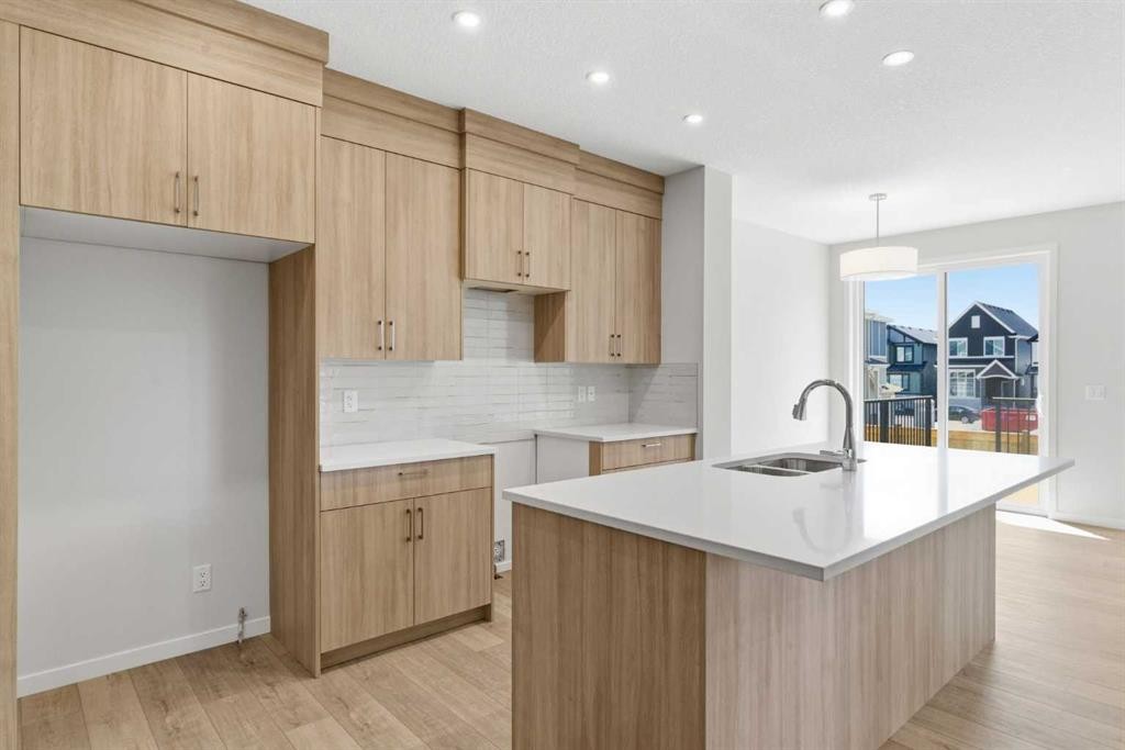 53 Snowberry Common Se, Calgary, AB - Indoor Photo Showing Kitchen With Double Sink