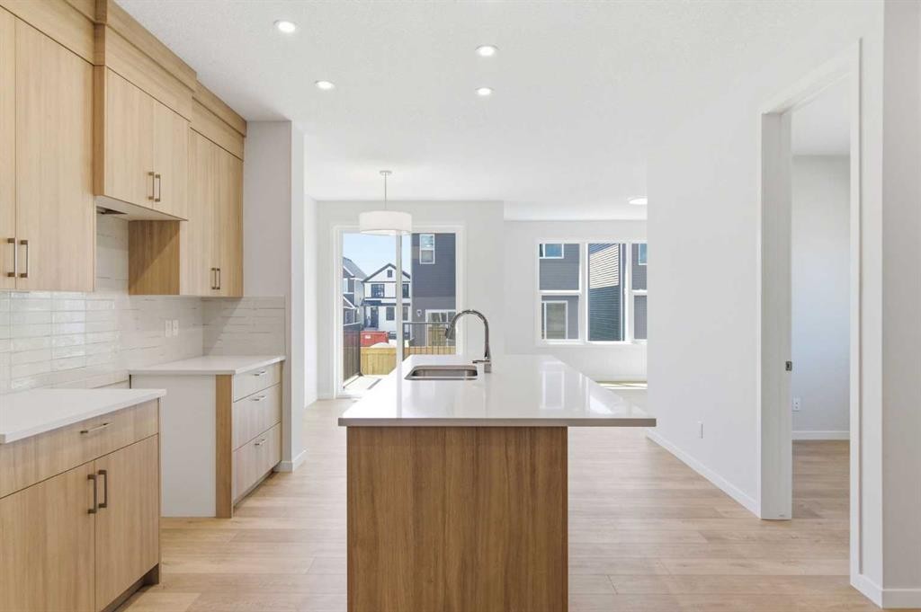 53 Snowberry Common Se, Calgary, AB - Indoor Photo Showing Kitchen With Double Sink