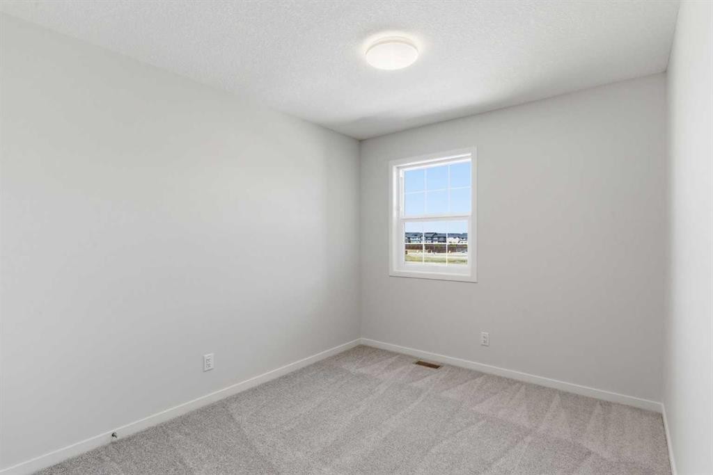 53 Snowberry Common Se, Calgary, AB - Indoor Photo Showing Other Room