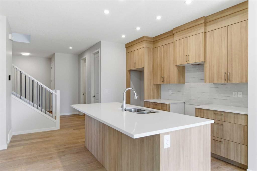 53 Snowberry Common Se, Calgary, AB - Indoor Photo Showing Kitchen With Double Sink