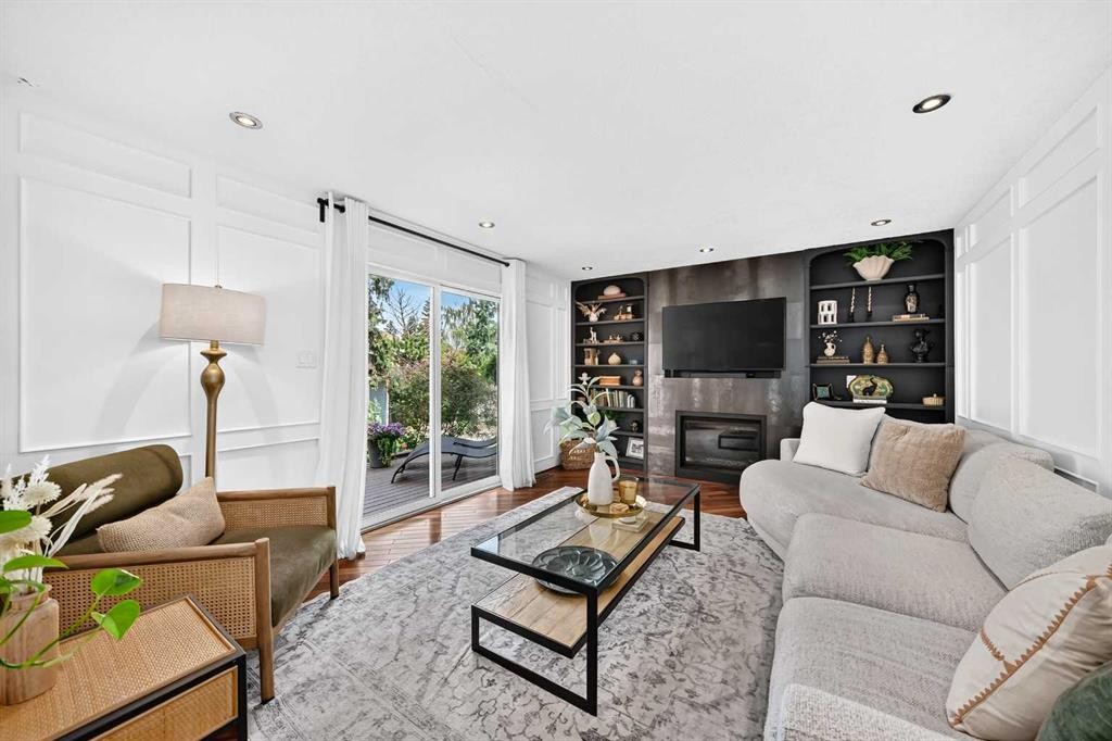 28 Woodmont Place Sw, Calgary, AB - Indoor Photo Showing Living Room With Fireplace