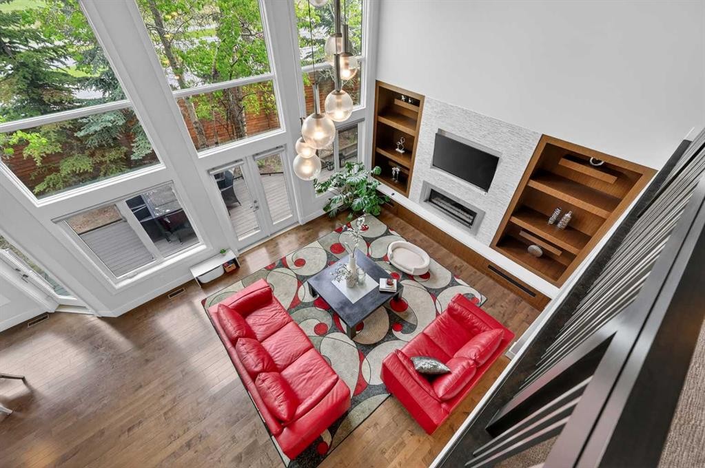 168 Posthill Drive Sw, Calgary, AB - Indoor Photo Showing Other Room With Fireplace