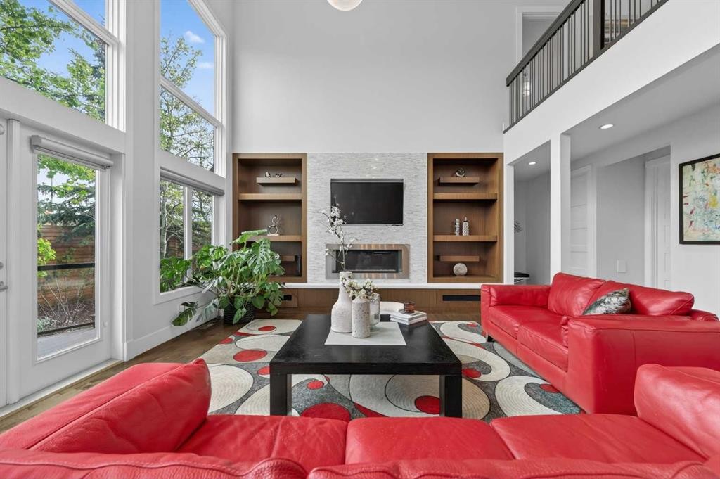168 Posthill Drive Sw, Calgary, AB - Indoor Photo Showing Other Room With Fireplace