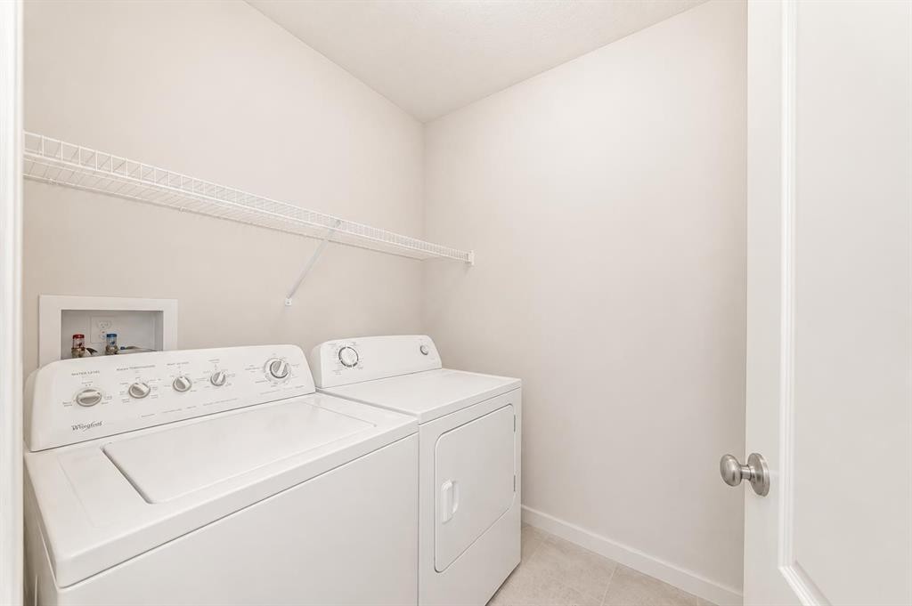 571 Seton Circle Se, Calgary, AB - Indoor Photo Showing Laundry Room