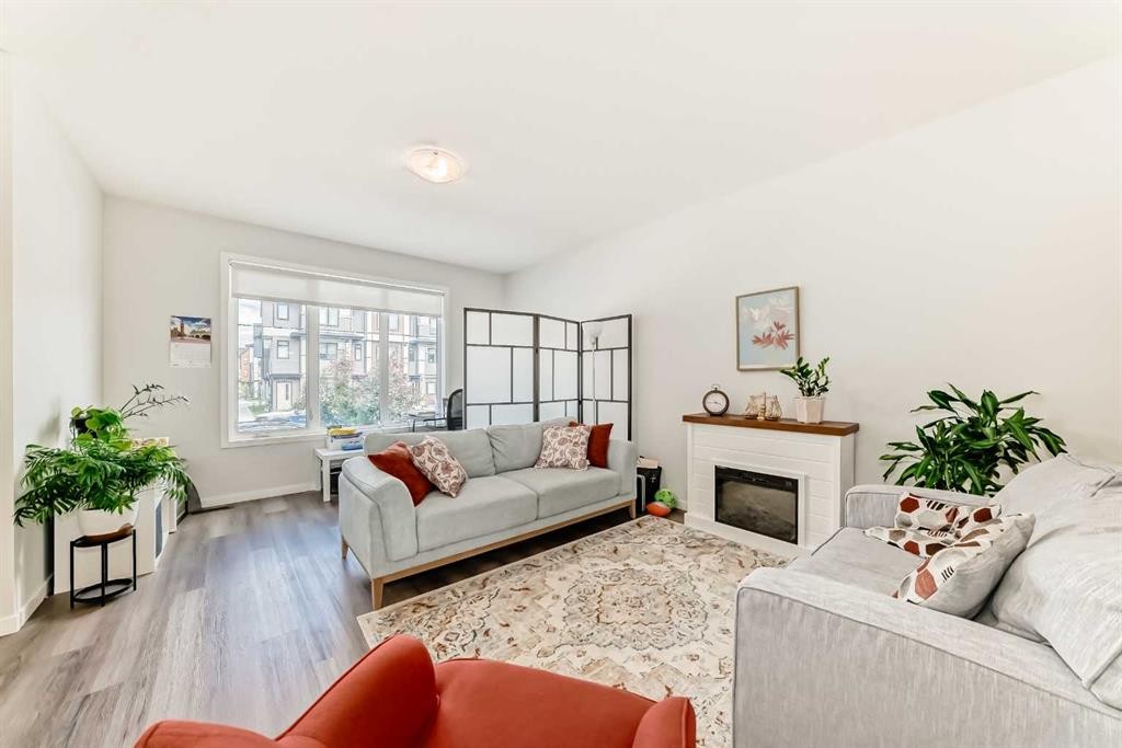 535 Seton Circle Se, Calgary, AB - Indoor Photo Showing Living Room With Fireplace