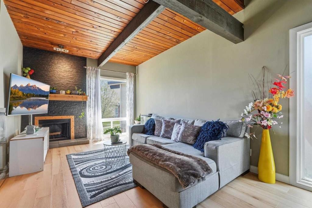 416 Pinemont Gate Ne, Calgary, AB - Indoor Photo Showing Living Room With Fireplace