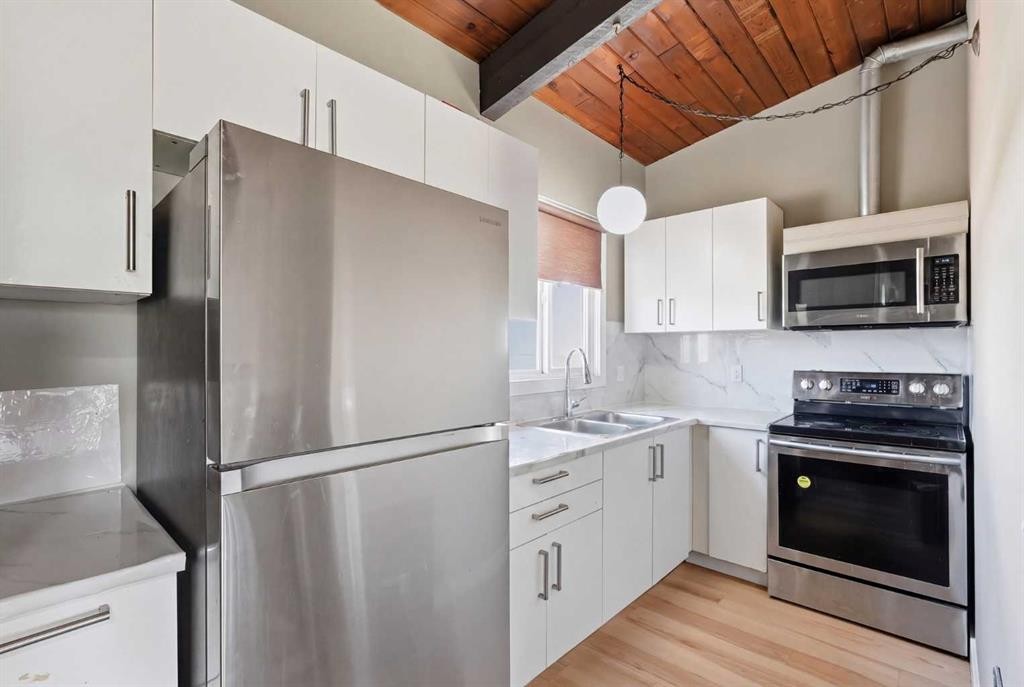 416 Pinemont Gate Ne, Calgary, AB - Indoor Photo Showing Kitchen With Stainless Steel Kitchen With Double Sink