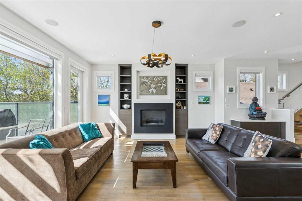 911 Drury Avenue Ne, Calgary, AB - Indoor Photo Showing Living Room With Fireplace