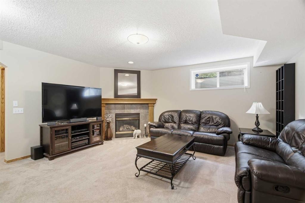 69 Chaparral Villas Se, Calgary, AB - Indoor Photo Showing Other Room With Fireplace