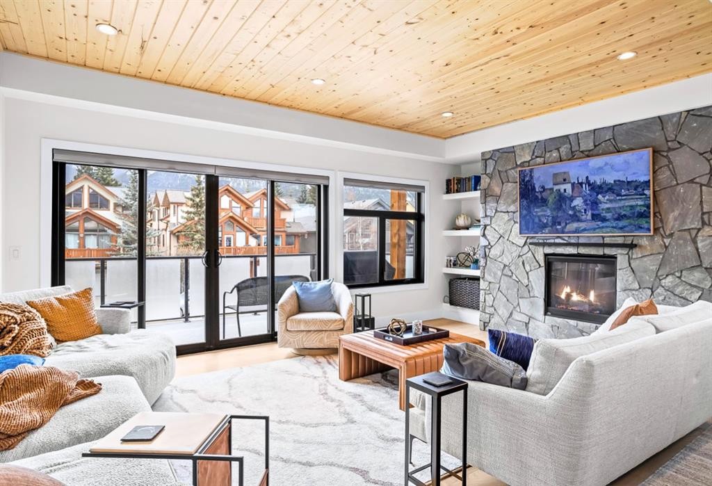 1-826 7Th Street, Canmore, AB - Indoor Photo Showing Living Room With Fireplace
