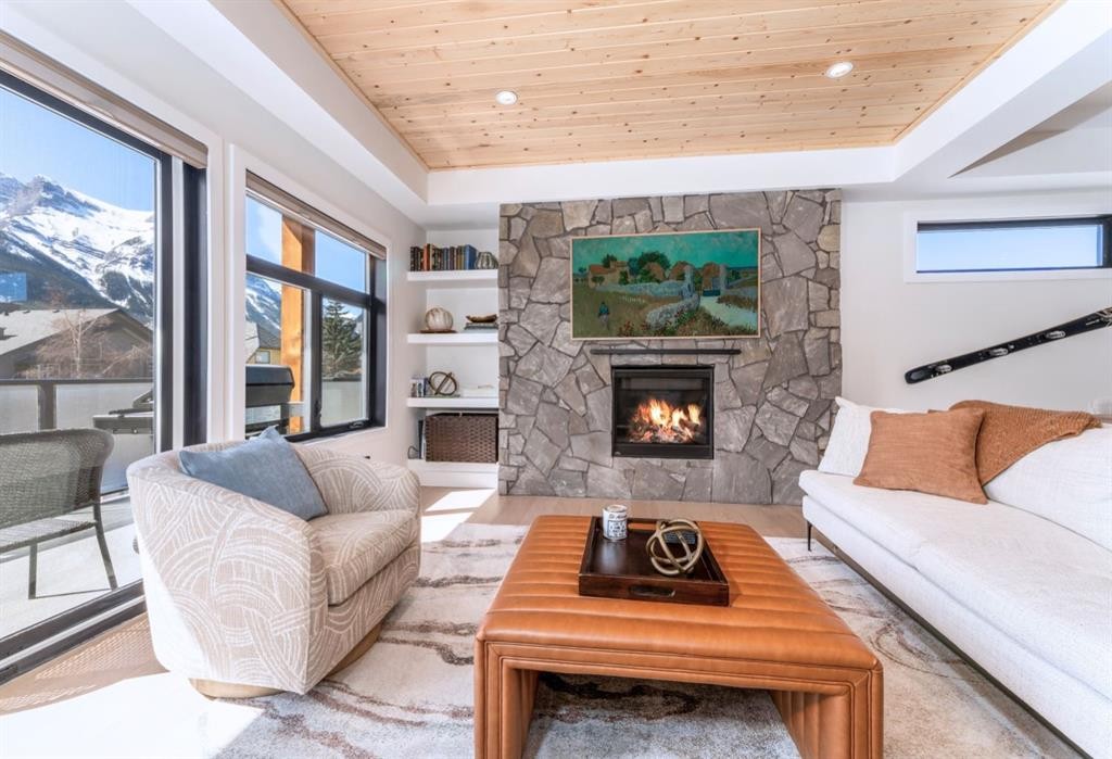 1-826 7Th Street, Canmore, AB - Indoor Photo Showing Living Room With Fireplace