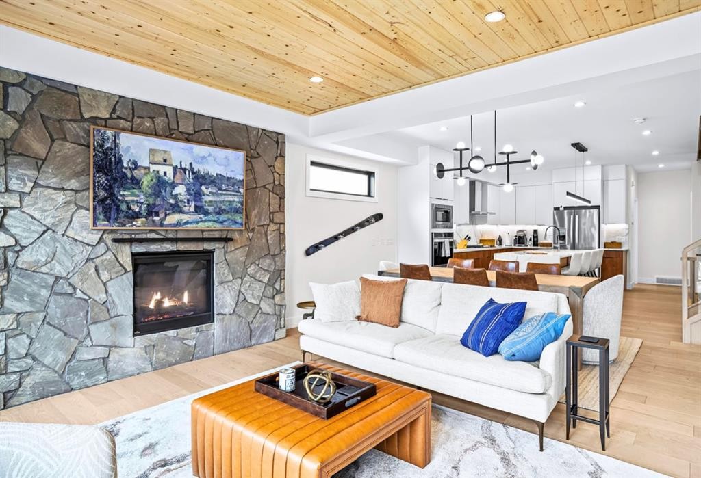 1-826 7Th Street, Canmore, AB - Indoor Photo Showing Living Room With Fireplace