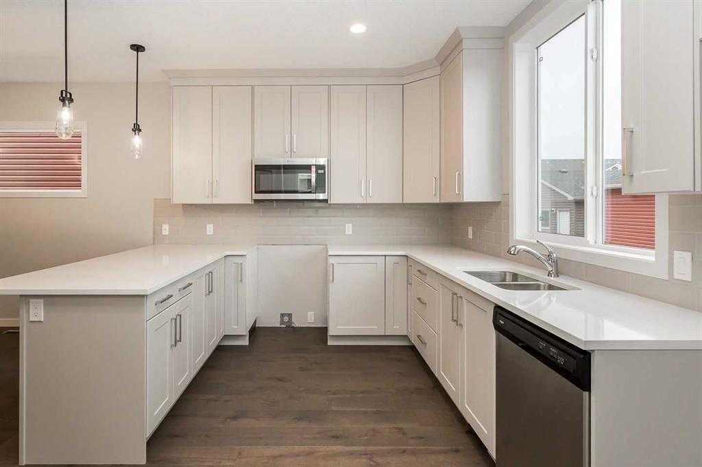 504 Kitstone Gate, Carstairs, AB - Indoor Photo Showing Kitchen With Double Sink