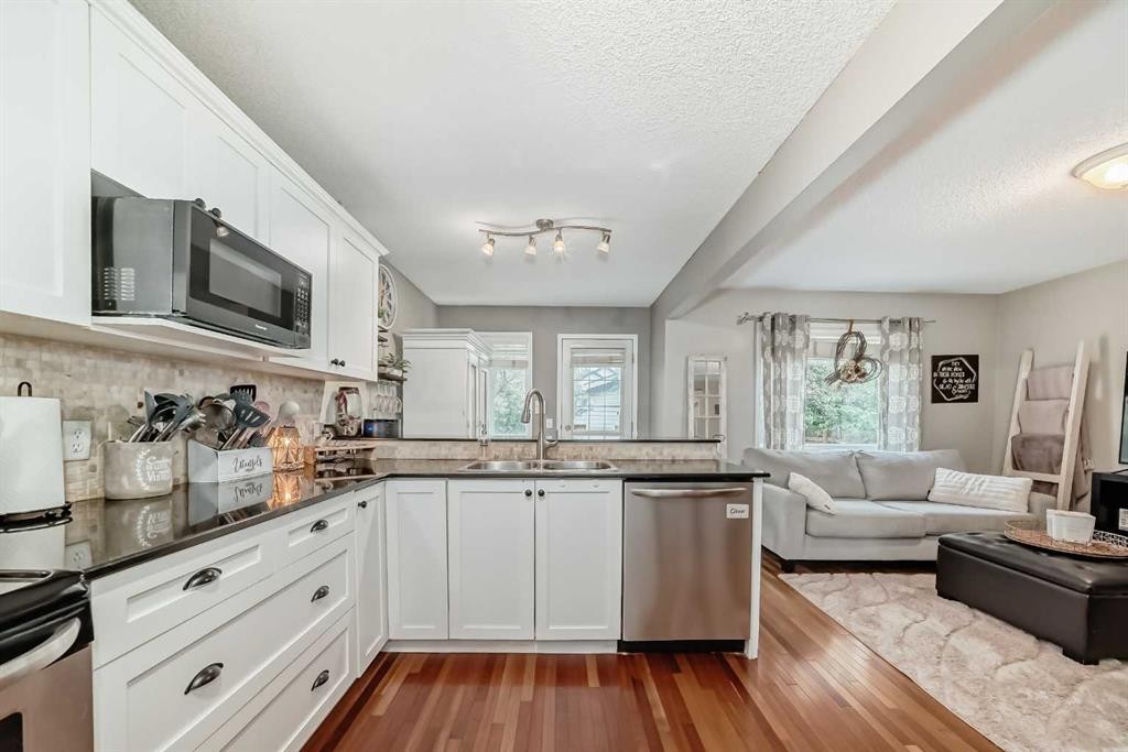 132 Hidden Hills Road Nw, Calgary, AB - Indoor Photo Showing Kitchen With Double Sink