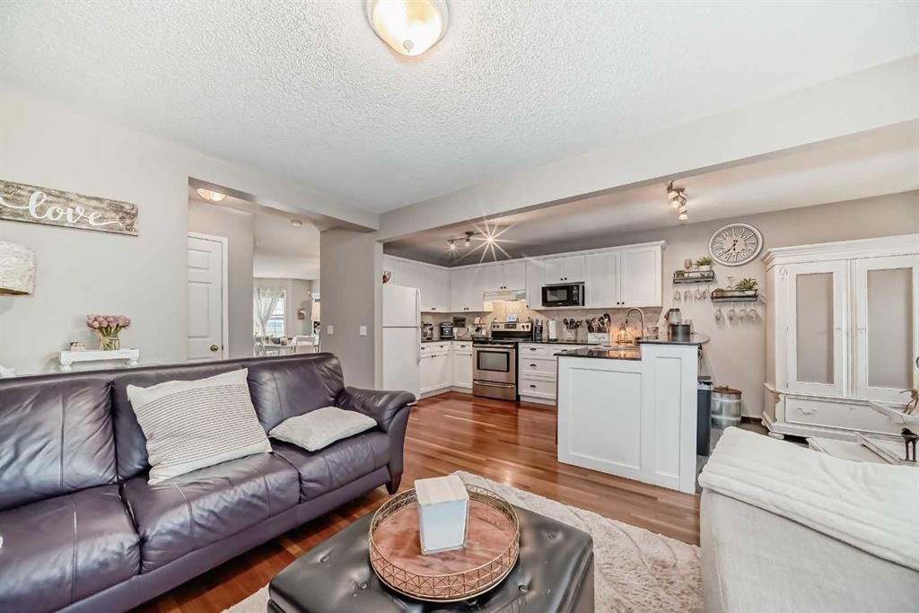 132 Hidden Hills Road Nw, Calgary, AB - Indoor Photo Showing Living Room