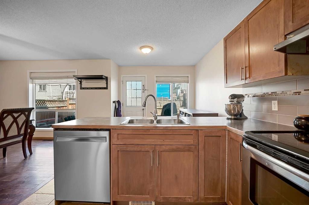 19 Coventry Link Ne, Calgary, AB - Indoor Photo Showing Kitchen With Double Sink