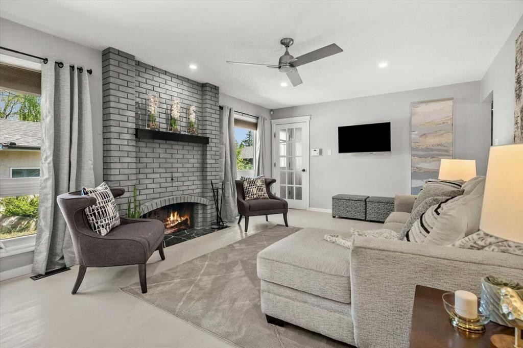 784 Acadia Drive Se, Calgary, AB - Indoor Photo Showing Living Room With Fireplace