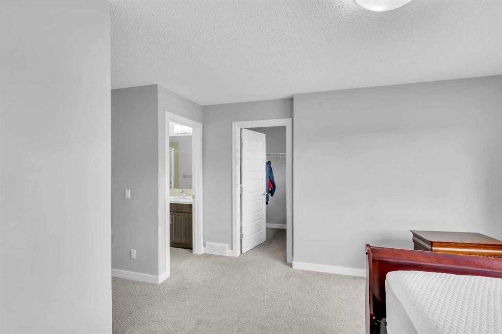 52 Red Embers Manor Ne, Calgary, AB - Indoor Photo Showing Bedroom