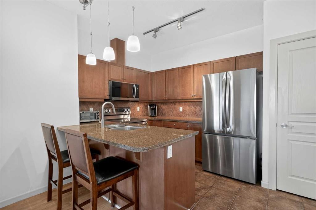 316-30 Cranfield Link Se, Calgary, AB - Indoor Photo Showing Kitchen With Stainless Steel Kitchen With Double Sink