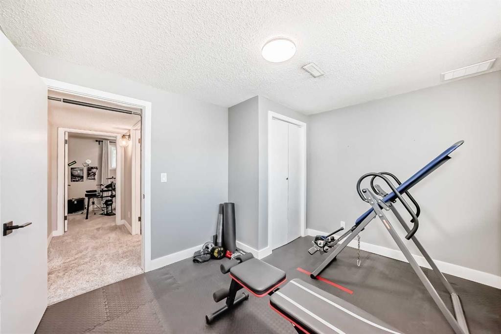 170 Lake Sylvan Close Se, Calgary, AB - Indoor Photo Showing Gym Room