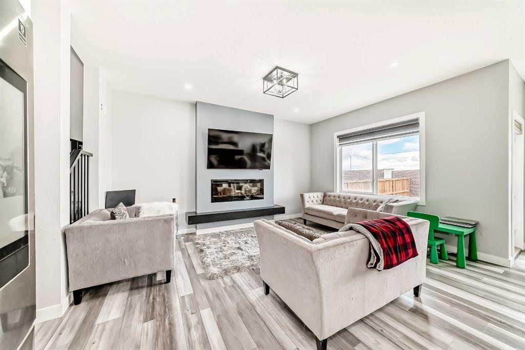 123 Red Sky Crescent Ne, Calgary, AB - Indoor Photo Showing Living Room With Fireplace