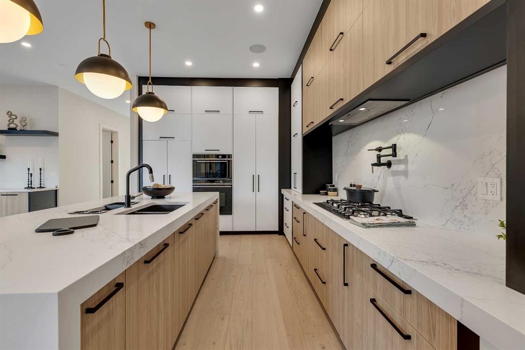 342 Normandy Drive Sw, Calgary, AB - Indoor Photo Showing Kitchen With Double Sink With Upgraded Kitchen