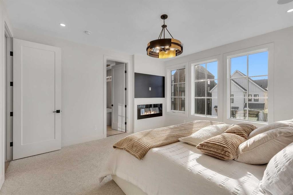 342 Normandy Drive Sw, Calgary, AB - Indoor With Fireplace