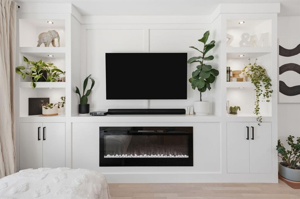 87 Armstrong Crescent Se, Calgary, AB - Indoor Photo Showing Living Room With Fireplace